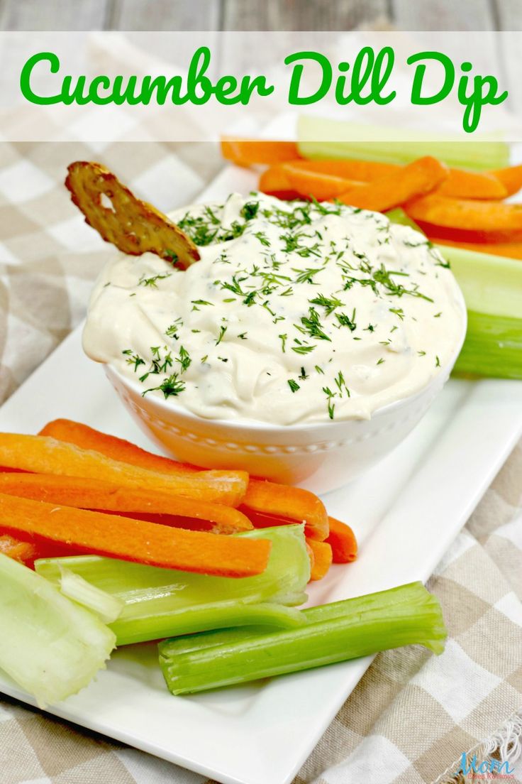 a white plate topped with celery, carrots and dip