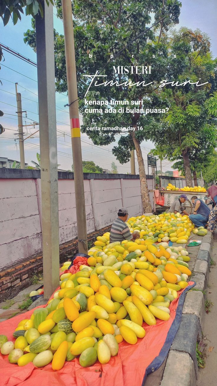 there is a large pile of fruit on the street