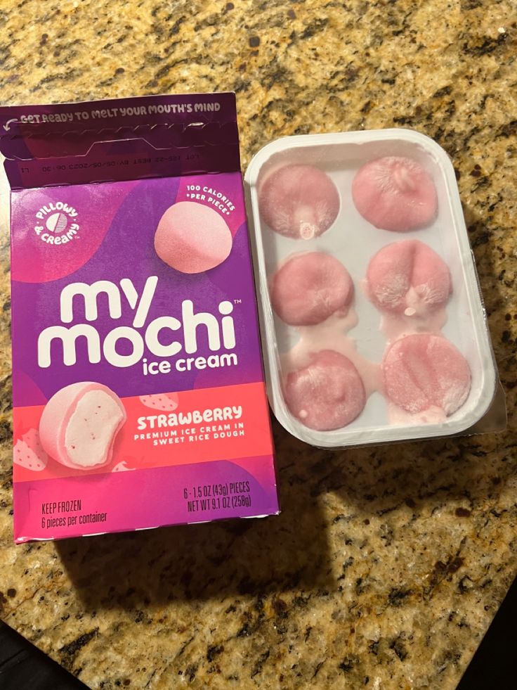 a box of ice cream next to a package of pink marshmallows on a counter