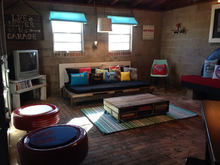 a living room filled with lots of furniture next to a tv and window sill