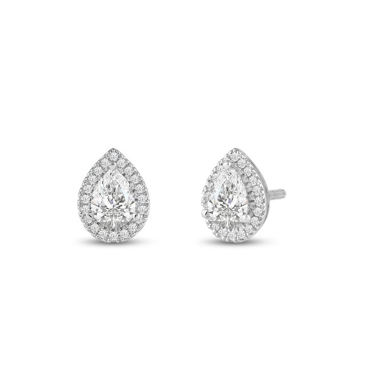 a pair of earrings with pear shaped diamonds