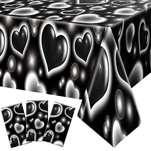 a black and white table cloth with hearts on it