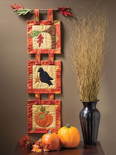 an image of a wall hanging decoration with pumpkins