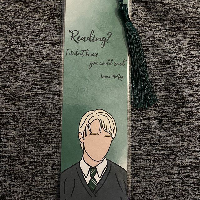 a bookmark with an image of a man in a suit and tie on it