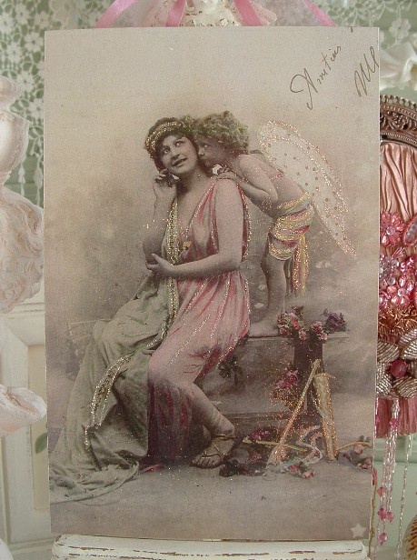 an old photo of two women dressed in pink