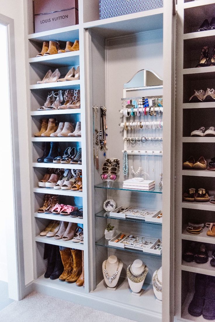 a closet filled with lots of shoes and jewelry