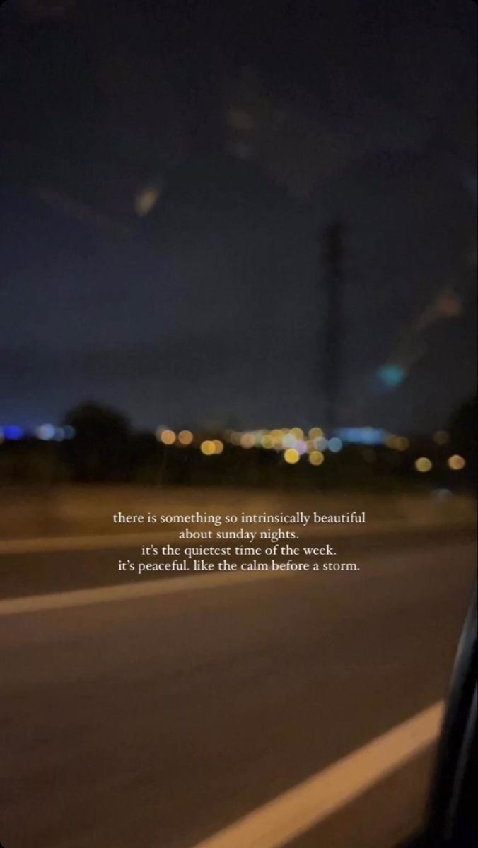 the view from inside a car at night with an inspirational quote on the window and street lights in the background