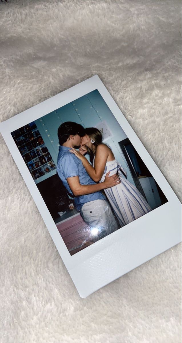 an image of a man and woman kissing on the forehead in front of a white background