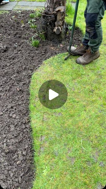 a man is using a lawn mower to cut the grass