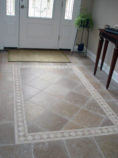 an entryway with a door and rug on the floor