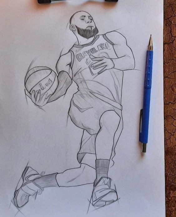 a drawing of a basketball player holding a ball on a piece of paper next to a marker