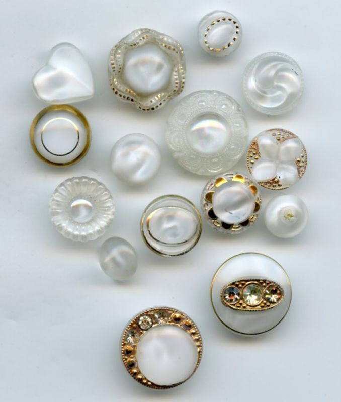 several different types of rings on a white surface