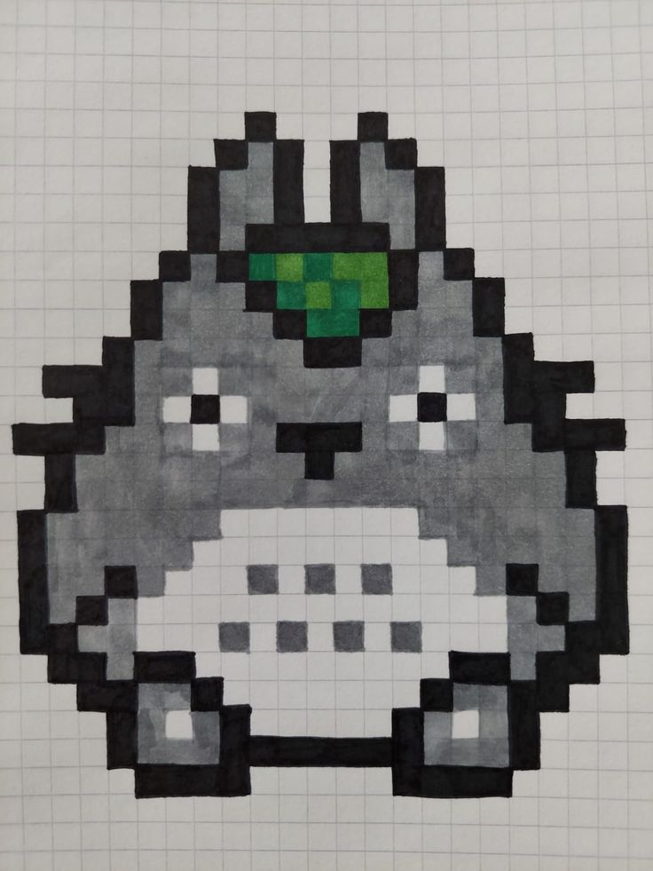 an image of a pixel art piece with a green eyed animal on it's face