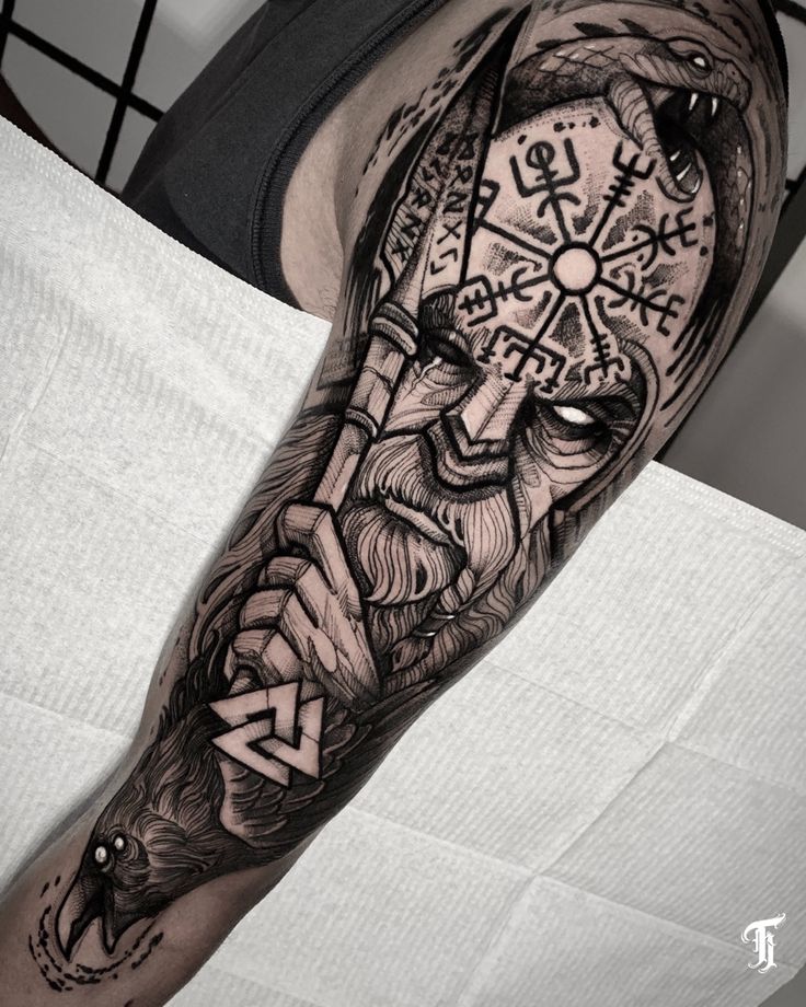 a black and white photo of a man's arm with a clock on it