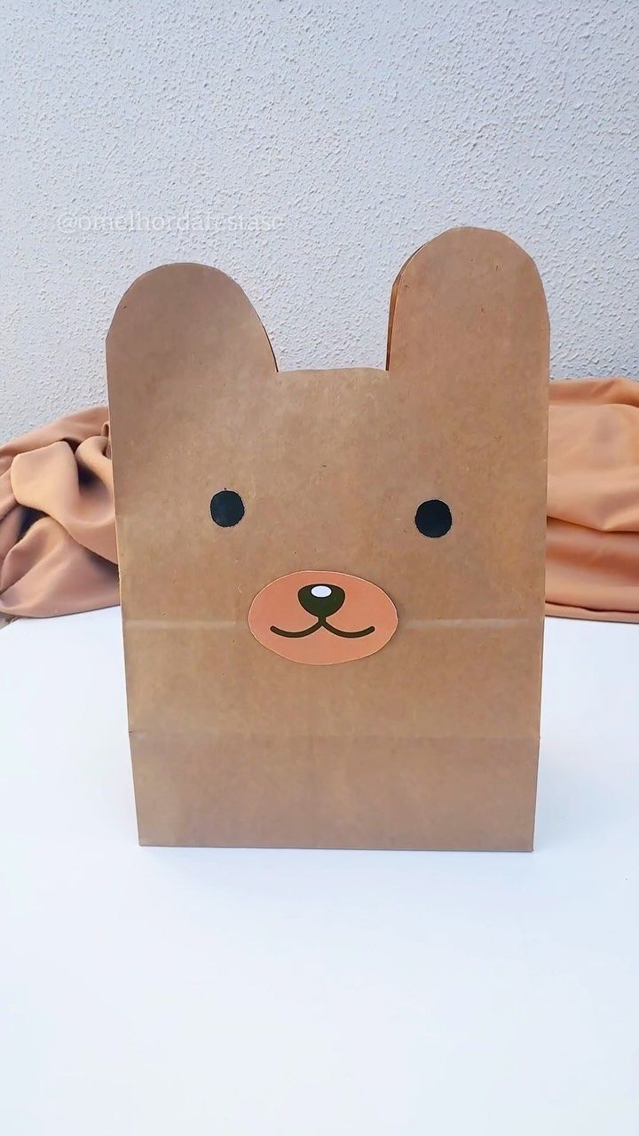 a brown paper bag with a bear face on it