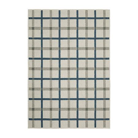 a white rug with blue and grey plaid pattern on the bottom, in front of a white background