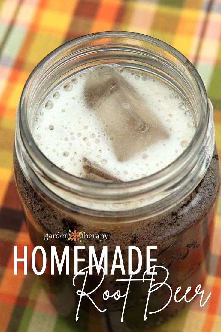 homemade root beer in a mason jar with the words, homemade root beer on it