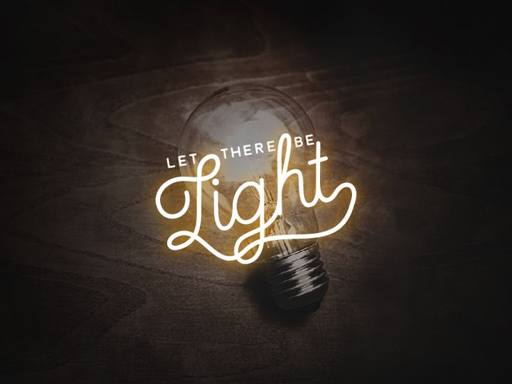 a light bulb with the words let there be light written in cursive font