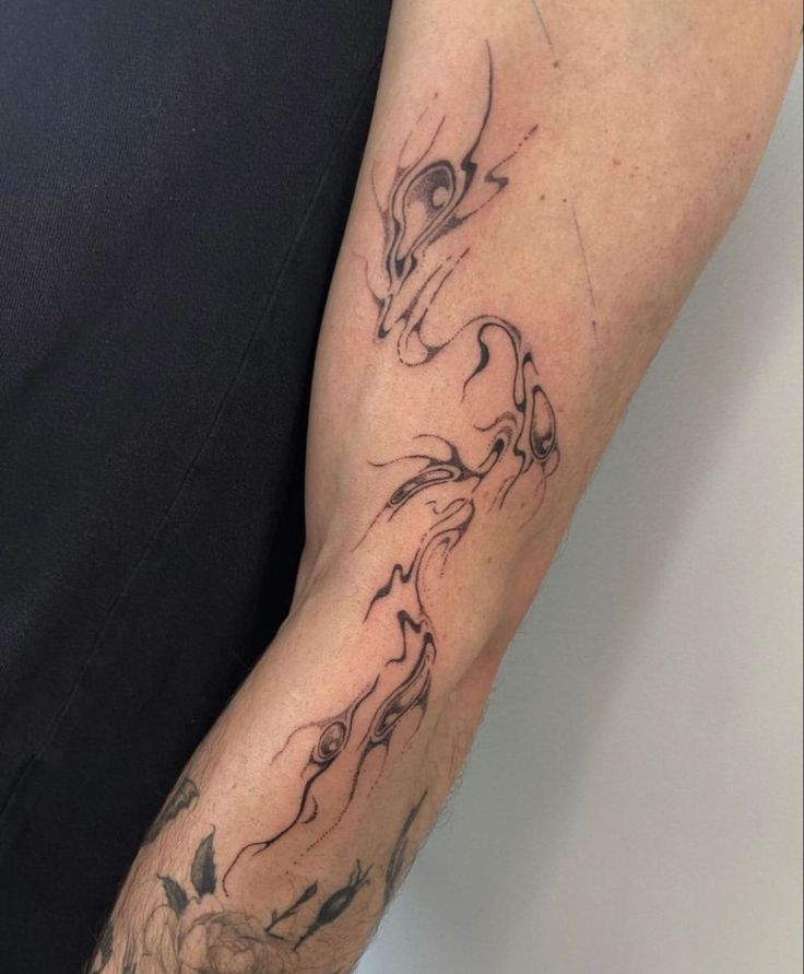 a person with a tattoo on their arm