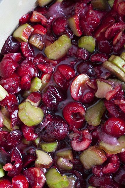 cranberry sauce in a white dish with apples and cucumbers