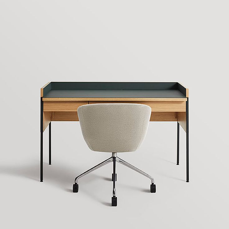 an office desk with a black top and white chair