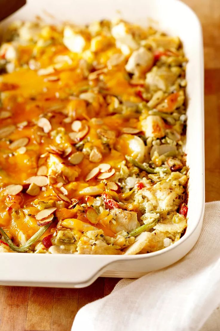 a casserole dish filled with vegetables and cheese