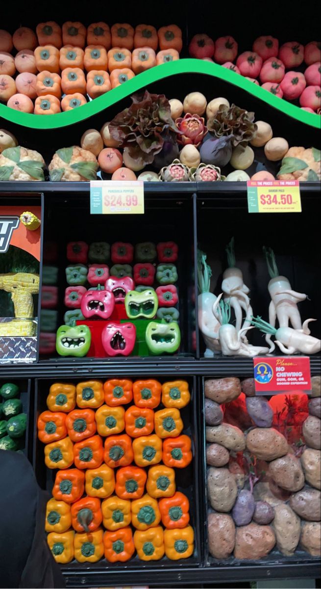 there are many different fruits and vegetables on display