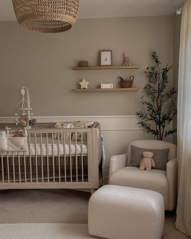 a baby's room with a crib, rocking chair and shelves on the wall