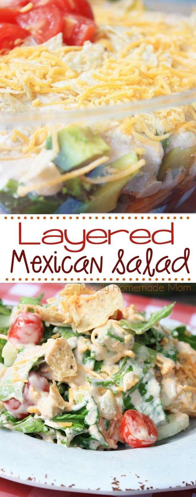 layered mexican salad with chicken, lettuce and tomatoes in a casserole dish