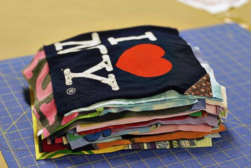 a pile of fabric sitting on top of a cutting board