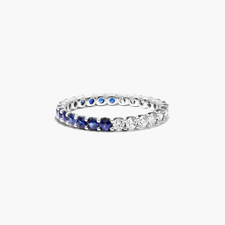 a white gold ring with blue sapphires and diamonds