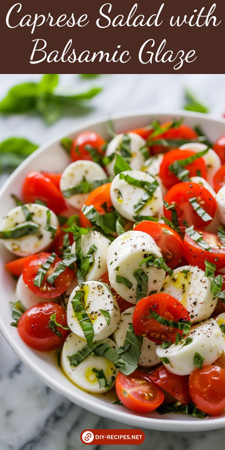 caprese salad with balsamic glaze in a white bowl on a marble table