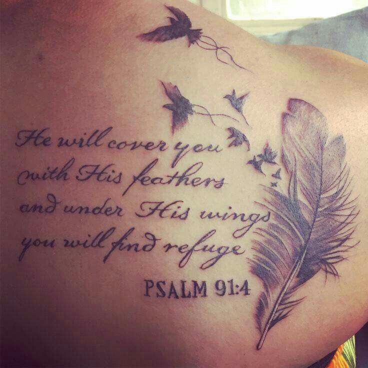 the back of a woman's shoulder with a quote on it and some birds flying around