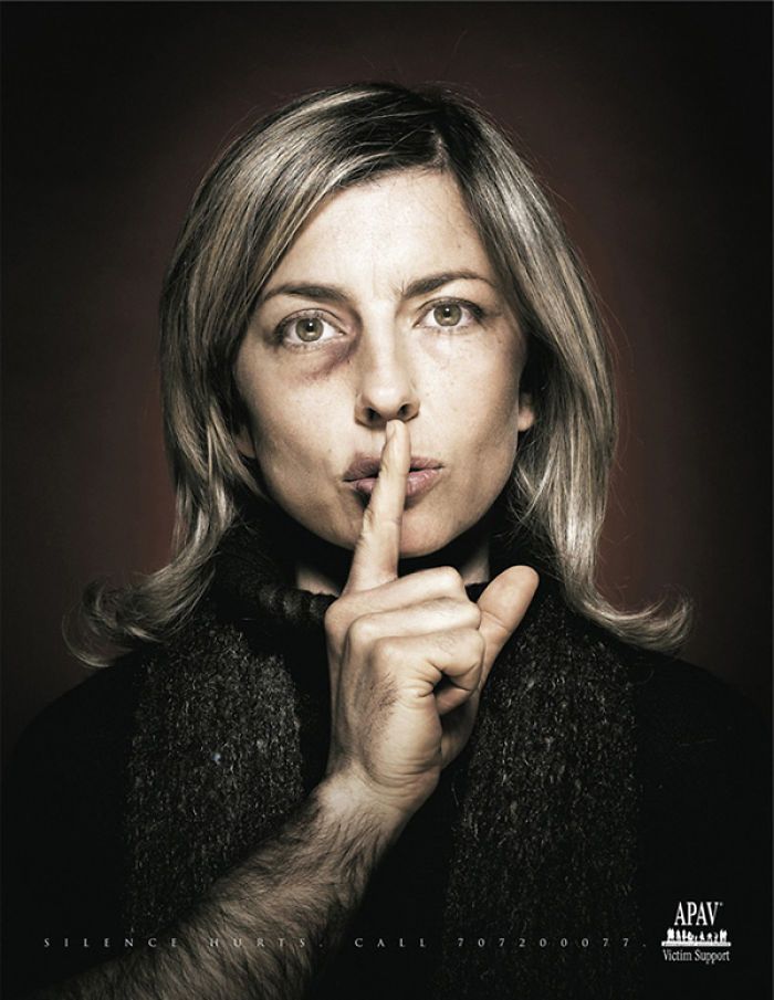 a woman making a hush with her finger