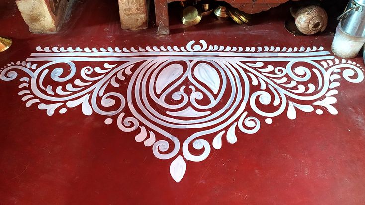 a red floor with white designs on it