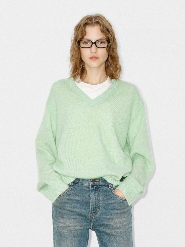 MO&Co. Women's V-neck Loose Sweater Offer in a mint hue, it's knitted from soft mohair, wool and polyamide. Features a classic V-neck, neatly ribbed trims, and cut in a relaxed shape. A perfect pair with jeans or a skirt for a chic and effortless look. Features : - Slightly loose fit- PU patch at the hem detail- V-neck and central back seam Code: MBD4SWT051The back length of size S is 61.5cmMATERIALS & CARE Material: 43.3% Polyamide 31.1% Mohair 25.6% WoolPlease put it into a mesh bag to wash.Wr Mint Fashion, Mohair Wool, Effortless Look, Loose Sweater, Mesh Bag, A Skirt, Perfect Pair, Pu Leather, Loose Fitting