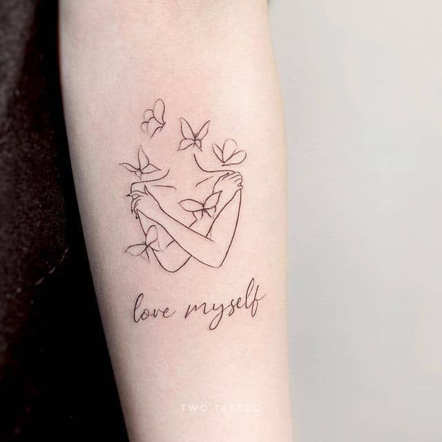 a woman's arm with a tattoo that says love my self