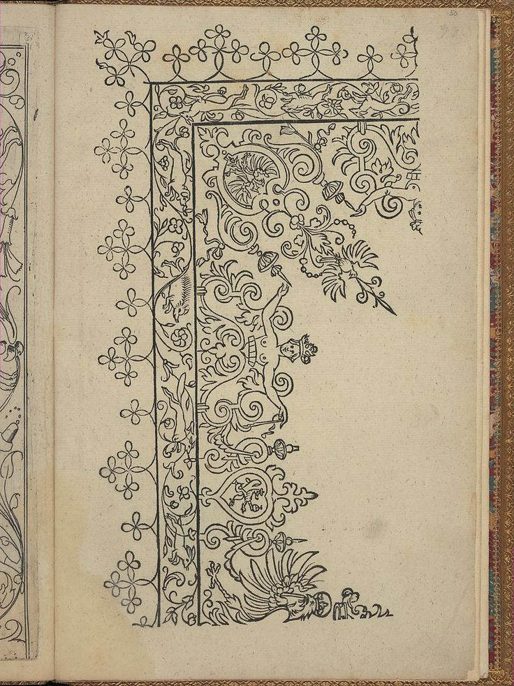 an open book with intricate designs on it