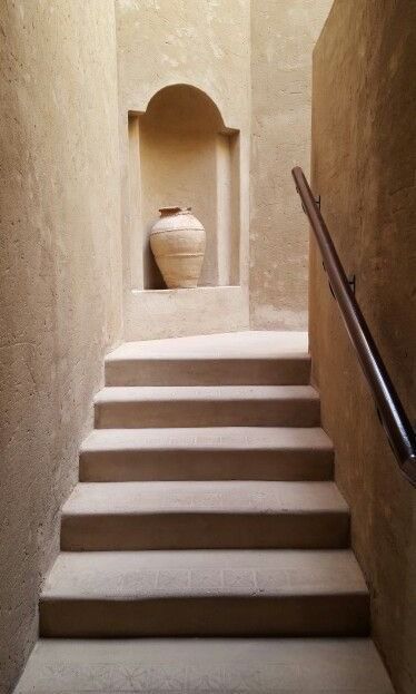 a set of stairs leading up to a vase