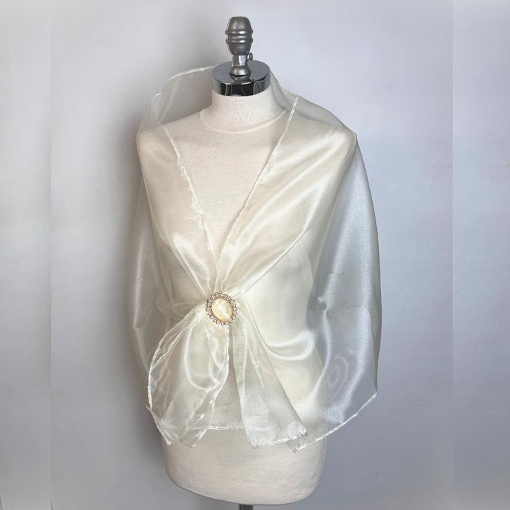 A very elegant organza shawl for your wedding party or evening dress. Made of light organza, slightly sparkles on the sun or light. Color: ivory or gold or blue green or black ( other colors are available ) Size : 150 cm x 48 cm approx   You can use it as a wrap, shawl or stola. WE have matching bags in our Etsy Shop! WE accept credit cards! Sheer Organza Party Veil, Sheer Organza Veil For Party, Elegant Fitted Evening Veil, Elegant Sheer Dupatta For Wedding, Elegant Fitted Veil, Elegant Fitted Sheer Veil, Elegant Sheer Fitted Veil, Elegant Sheer Dupatta For Formal Occasions, Elegant White Dupatta For Evening