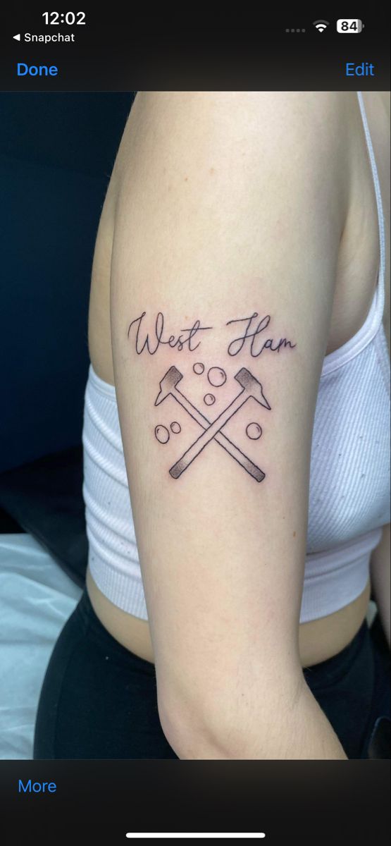 a woman with a tattoo on her arm that says, wait for the hammers