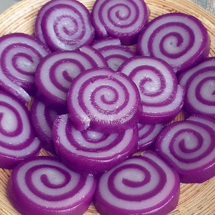 some purple onions are in a bowl on a table