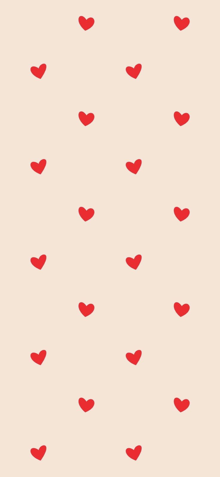 red hearts are arranged on a beige background