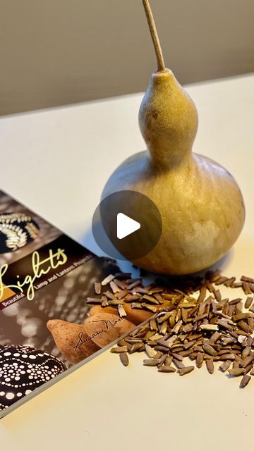 a pear and seeds on a table next to a book with the title, crafts