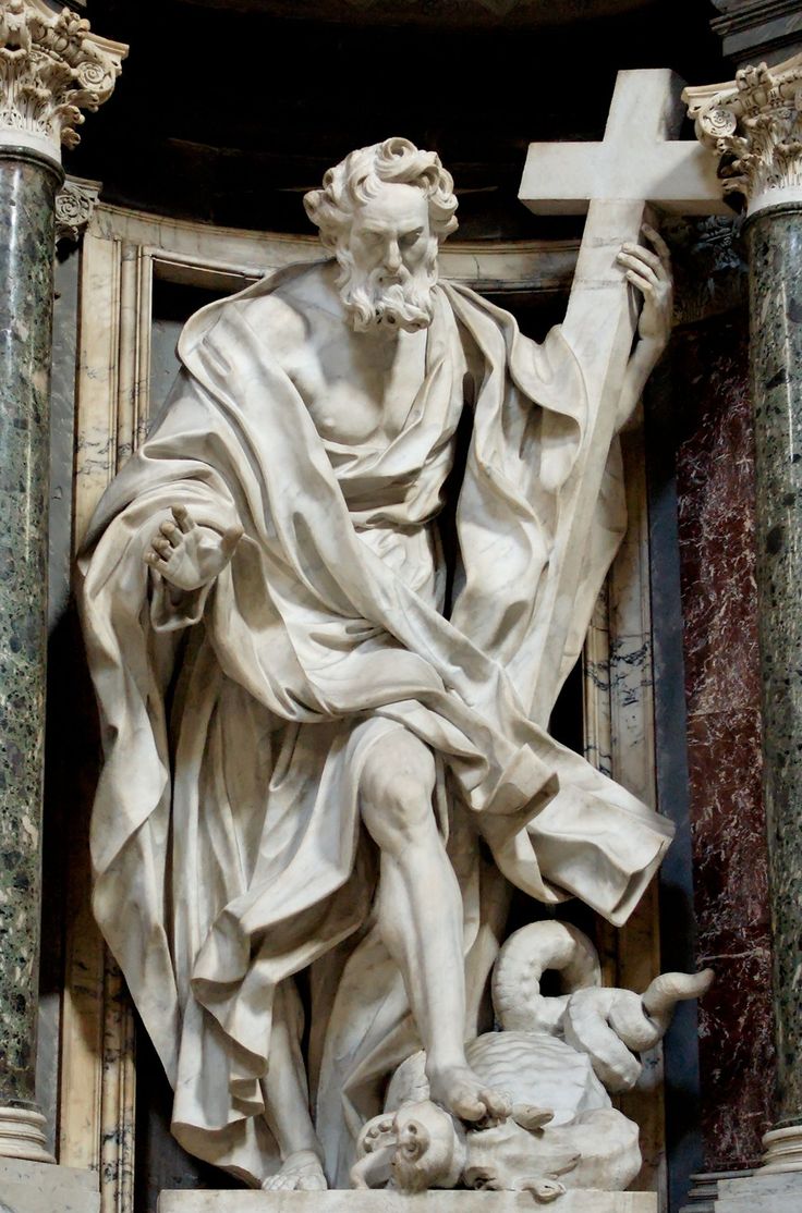 the statue of jesus with his cross and lamb in front of an ornate building - stock image