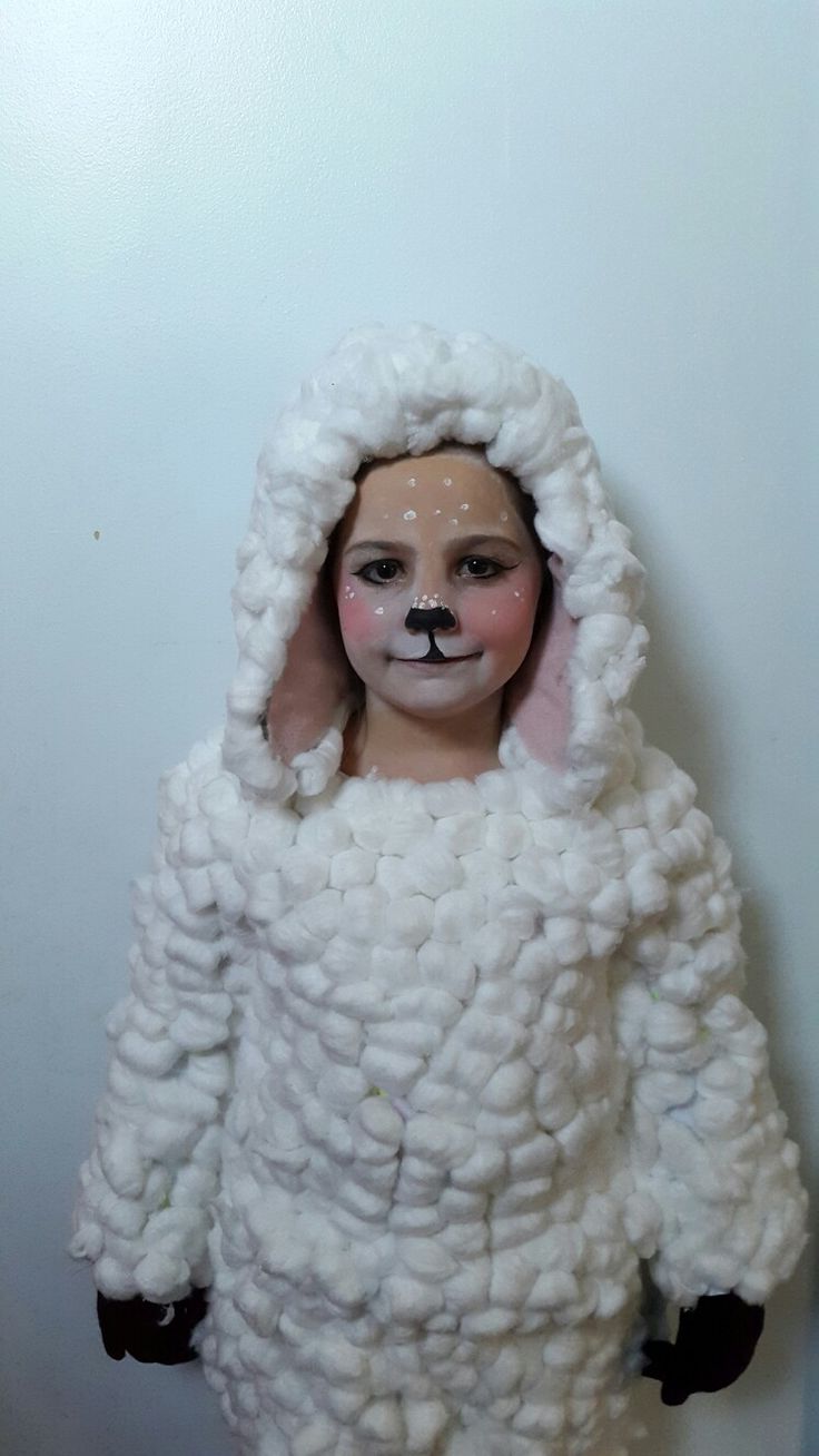 a doll is dressed up like a sheep