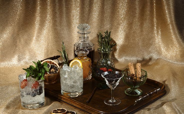 a tray topped with glasses filled with drinks