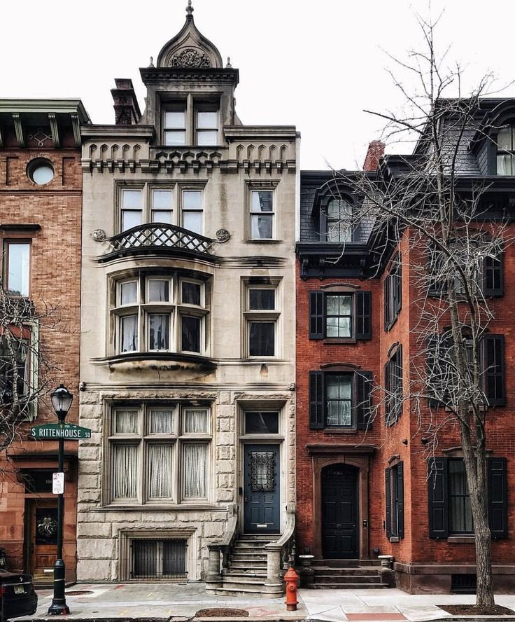 an old brick building with many windows and balconies