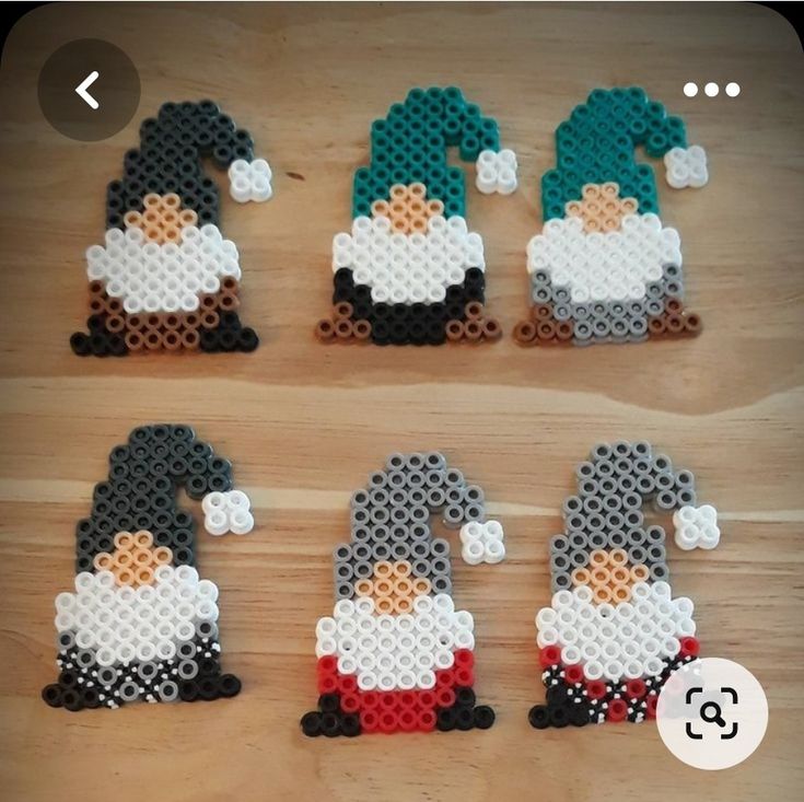 six pixellated images of gnomes made out of perforated plastic beads on a wooden surface