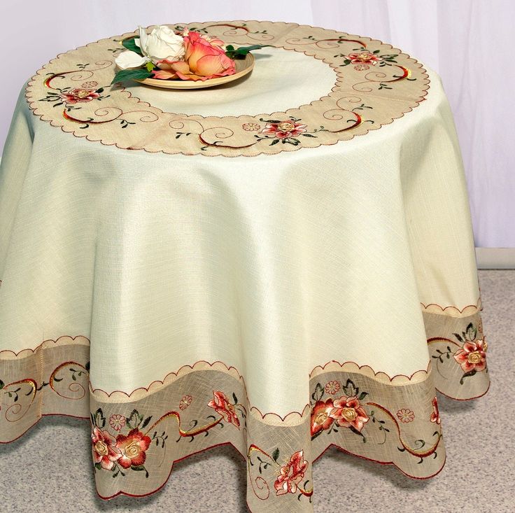 a white table cloth with flowers on it